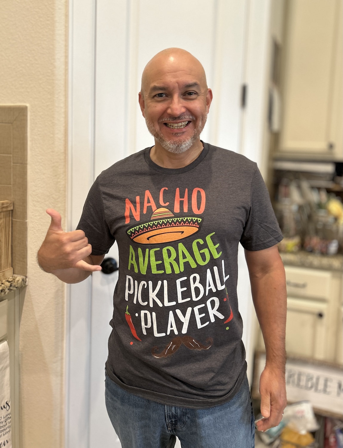 Monico wearing Nacho Average Pickleball Player tee